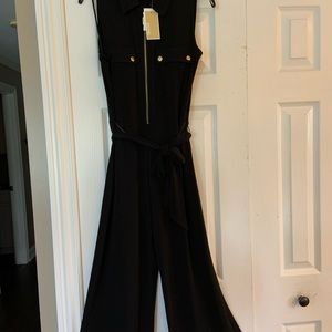 Beautiful gold accents with additional side zipper and belted waist. NWT